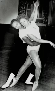 Black and white photo of Joan Myers Brown dancing with Billy Wilson for a cotillion in the 1950s